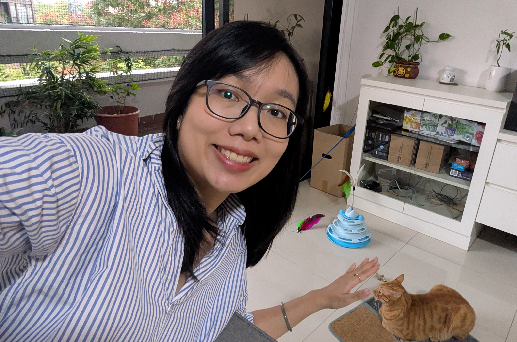 Photo of Wenjin with a cat